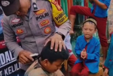 Polsek Sanga Desa Cukur Rambut Gratis Siswa SDN Ngunang, Tanamkan Disiplin Sejak Dini